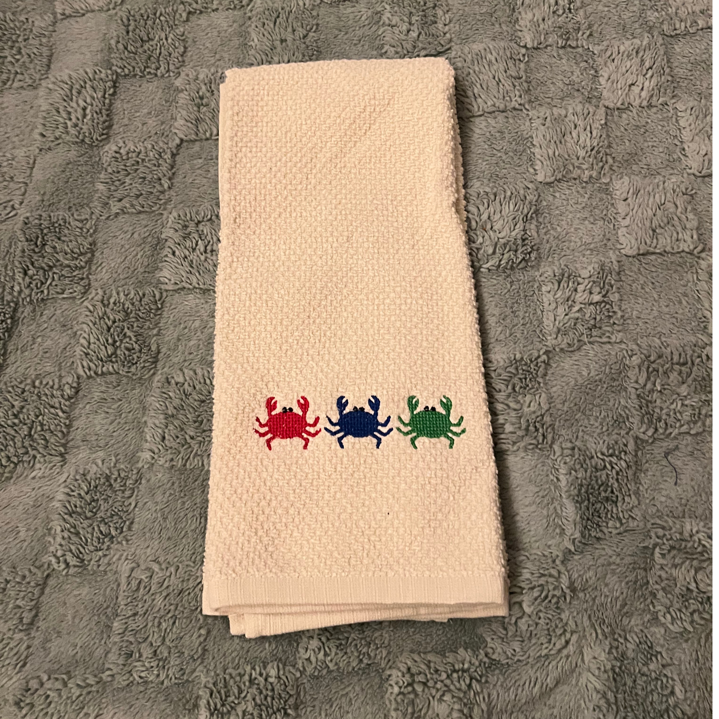 Galley Towel with 3 little crabs embroidered on it