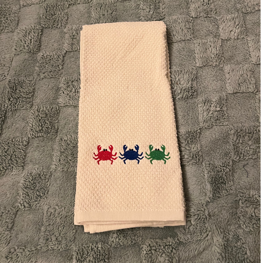 Galley Towel with 3 little crabs embroidered on it