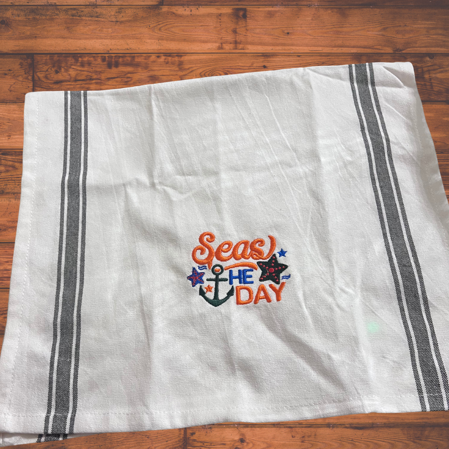 Embroidered dish towel "Seas the day" design