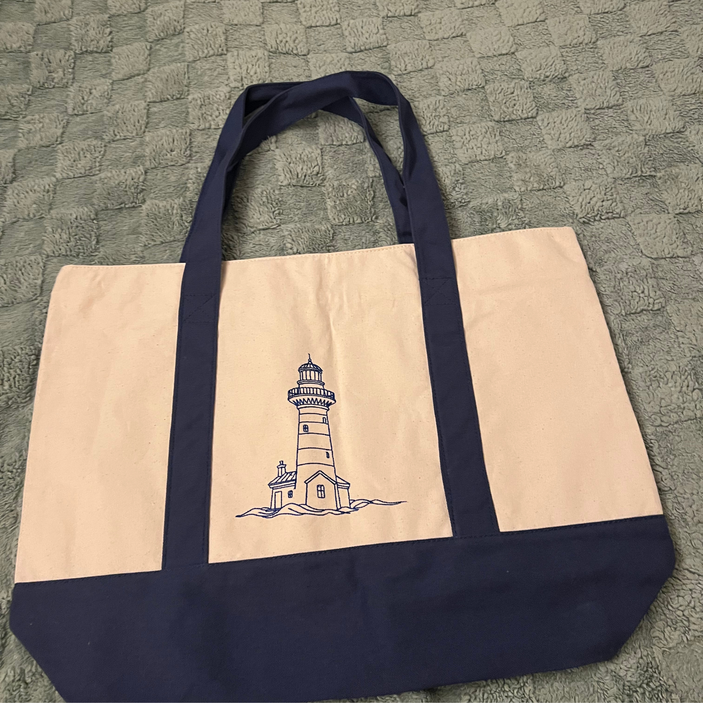 Nautical canvas bag embroidered with a lighthouse